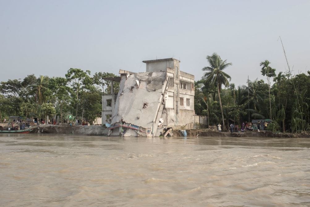 Ruins of the only government health complex in Naria after riverbank collapse.