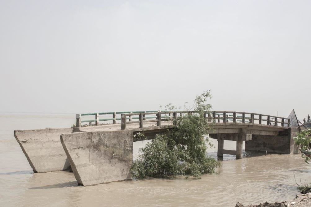 Collapsed bridge at Naria bazaar after major river erosion.
