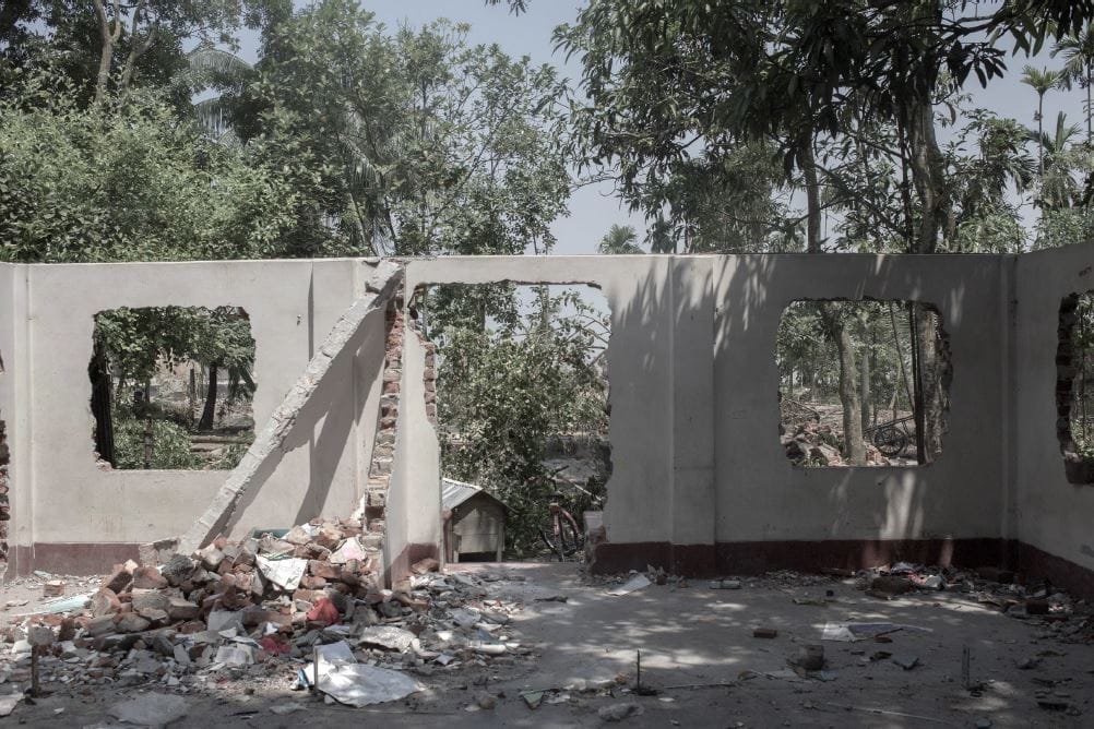 Abandoned house being dismantled in Naria as river erosion worsens.