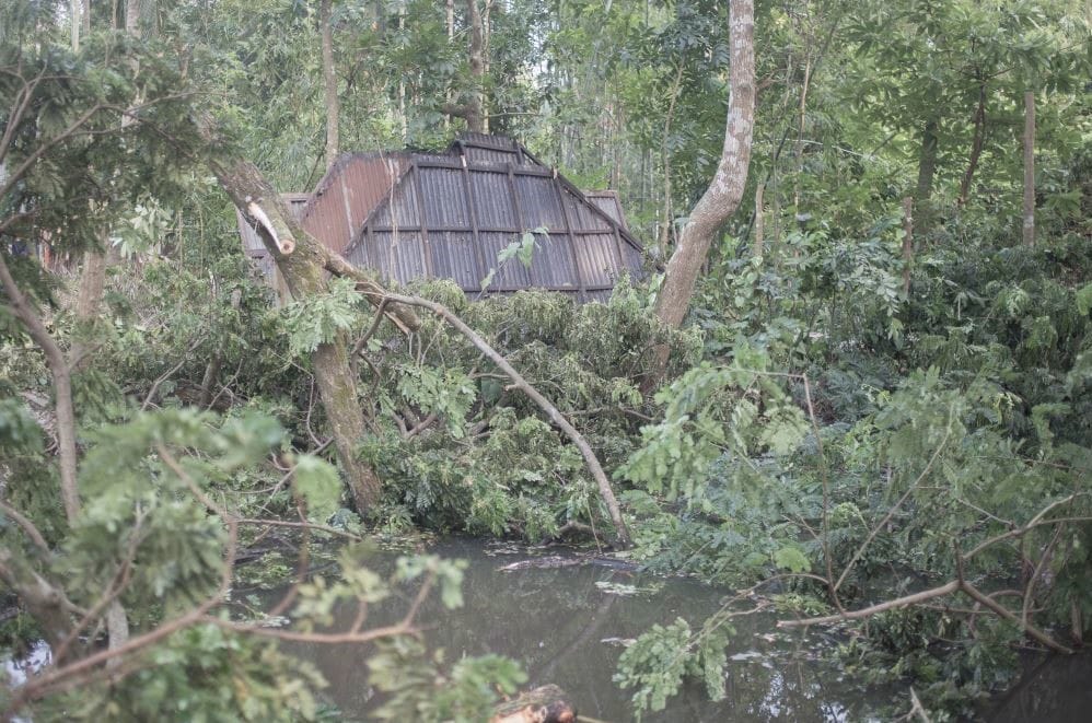 River advancing toward land cleared of homes and vegetation.